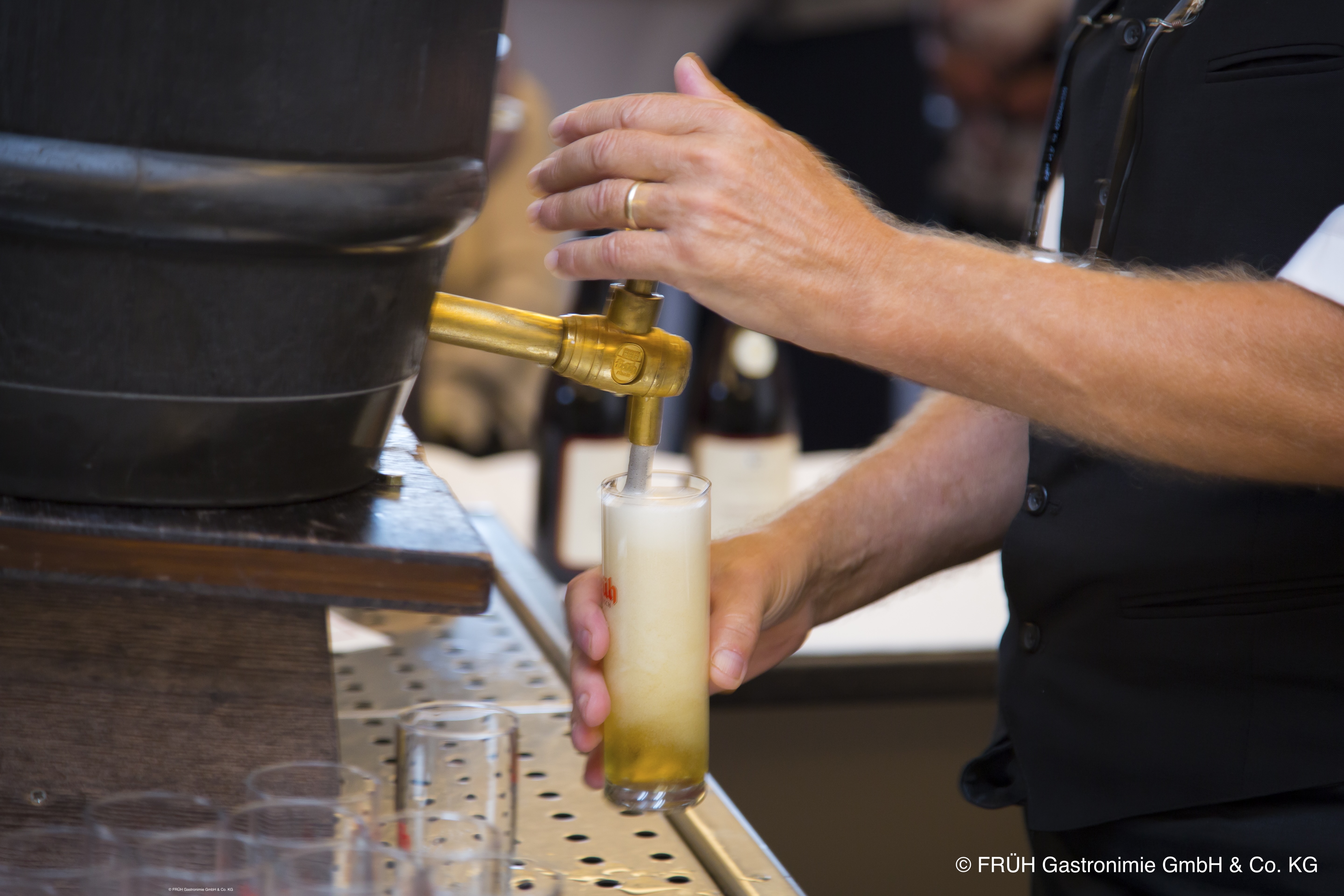 a person drawing beer