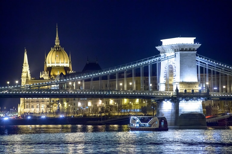 view from river level to parliament, by night